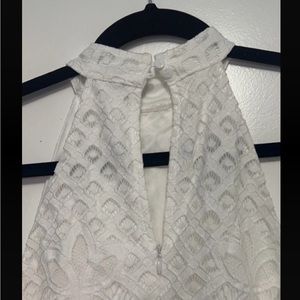 I’m selling this white pencil skimmed dress. The tag is still on it